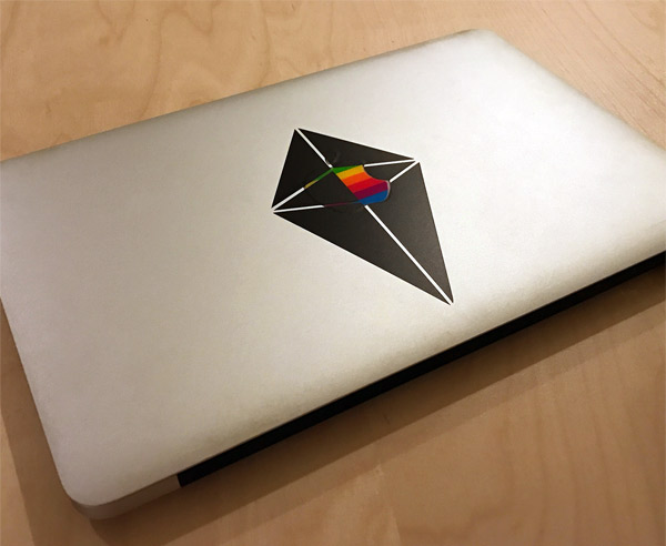MacBook Air laptop with No Man's Sky atlas logo sticker on the cover
