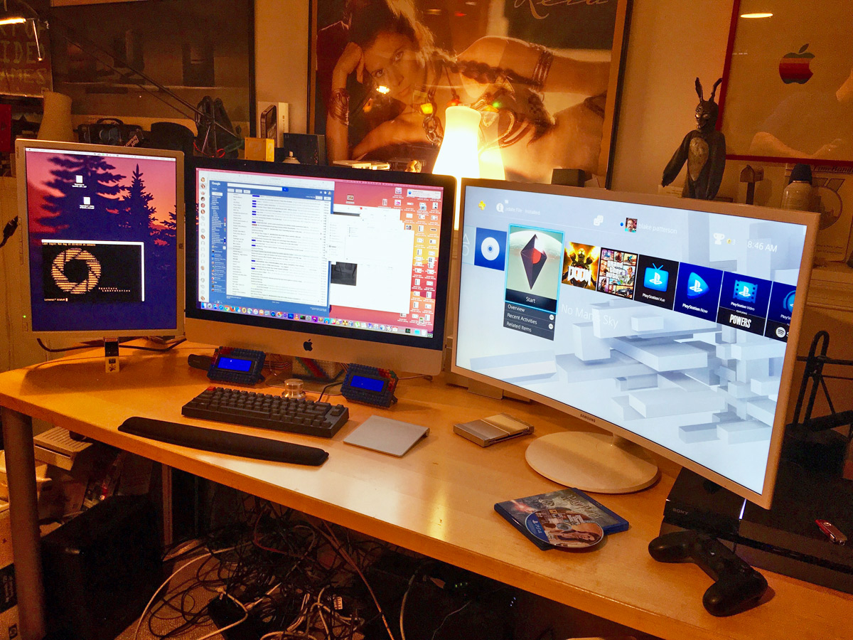 photo of computer desk with iMac on the left and a gaming PC on the right