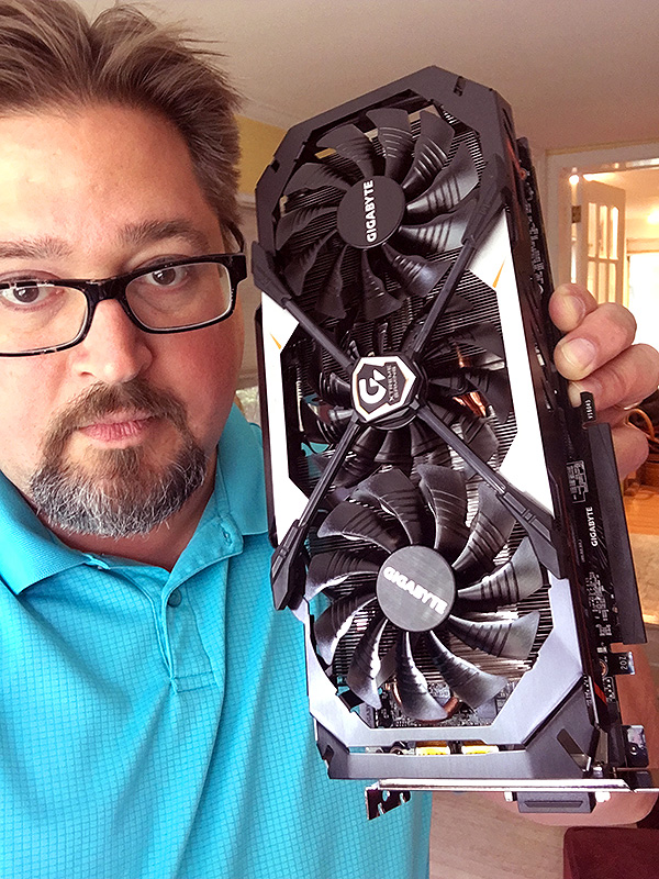 Blake holding a GeForce graphics card