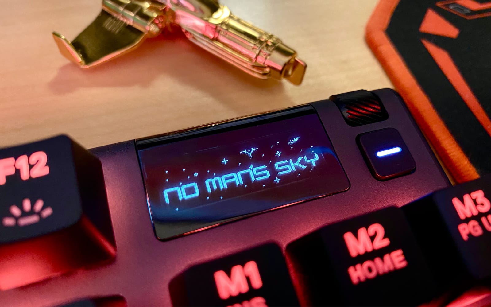 keyboard OLED display with No Man's Sky text shown